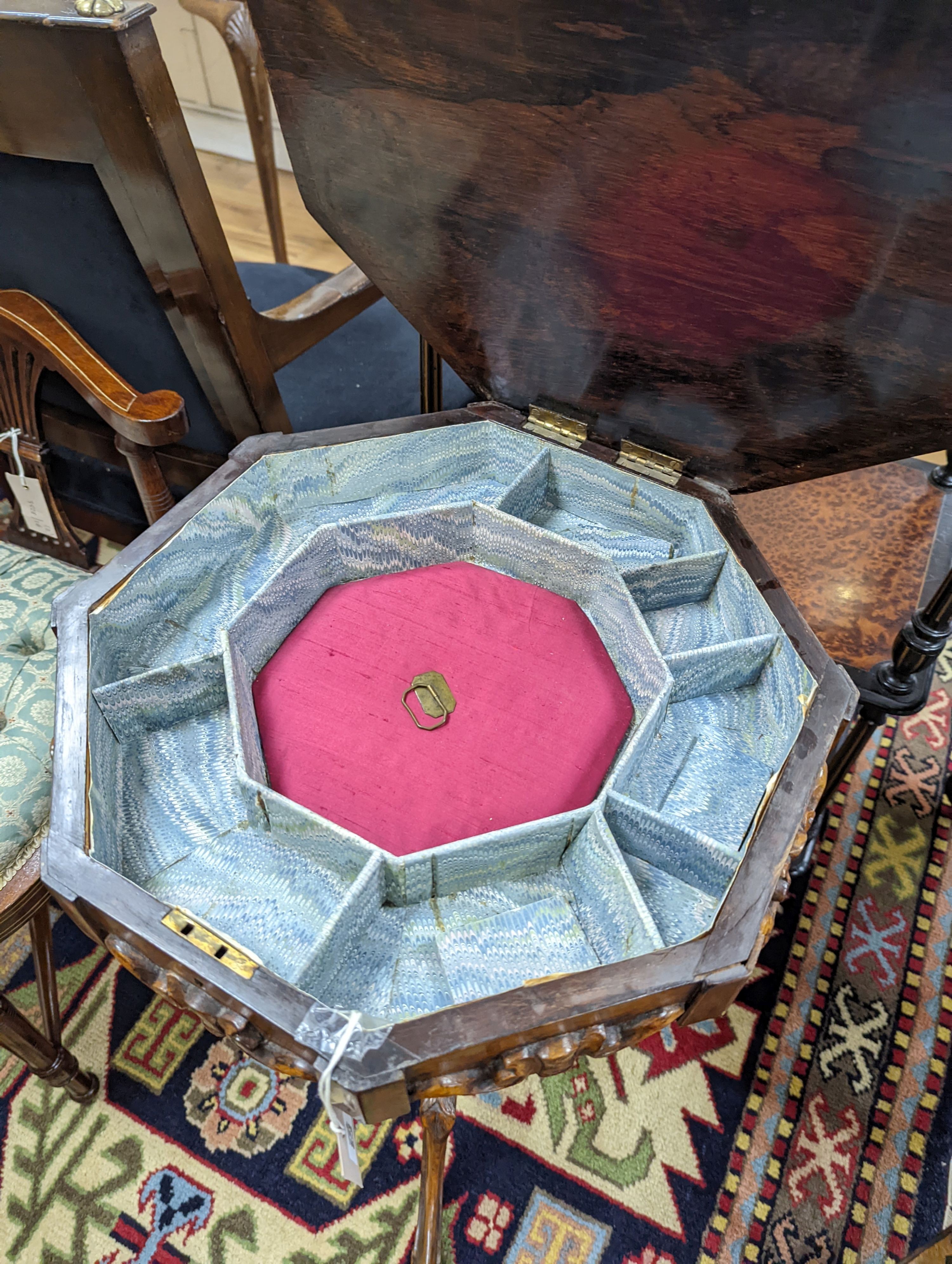 A Victorian octagonal walnut trumpet work table, width 42cm, height 73cm